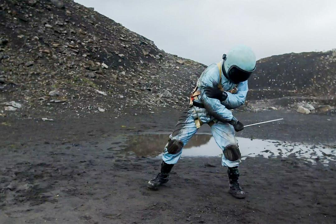 An astronaut struggles with an unseen enemy in a scene from INVISUS